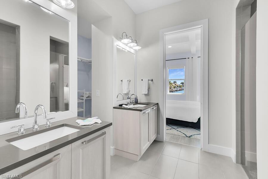 255 Columbus Way Marco Island, FL 34145 - Photo 22 of 50 a kitchen with a sink and a stove top oven
