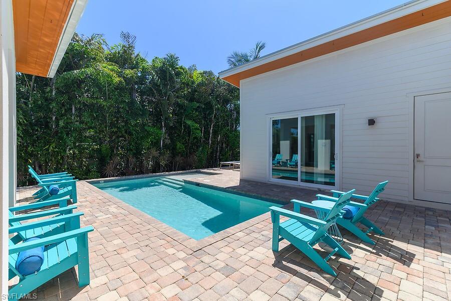 255 Columbus Way Marco Island, FL 34145 - Photo 25 of 50 a house with garden in front of it