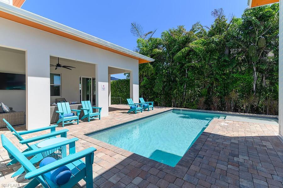 255 Columbus Way Marco Island, FL 34145 - Photo 26 of 50 a view of swimming pool with chairs