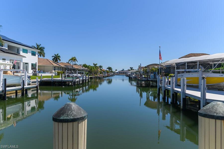 255 Columbus Way Marco Island, FL 34145 - Photo 3 of 50 a view of a lake with boats and trees in the background