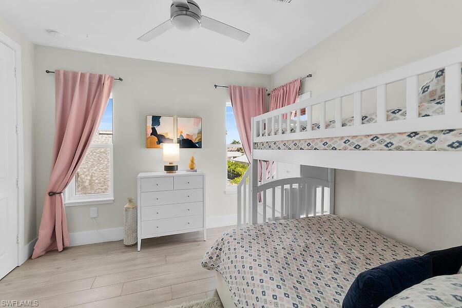 255 Columbus Way Marco Island, FL 34145 - Photo 36 of 50 a bedroom with a bed and a window