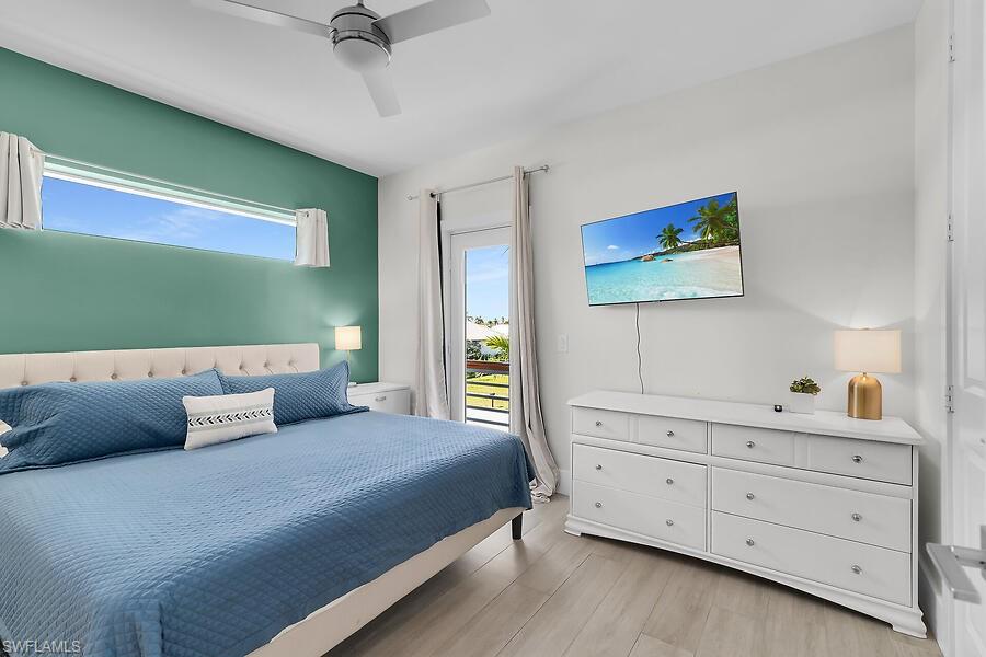 255 Columbus Way Marco Island, FL 34145 - Photo 39 of 50 a bedroom with a bed and a dresser