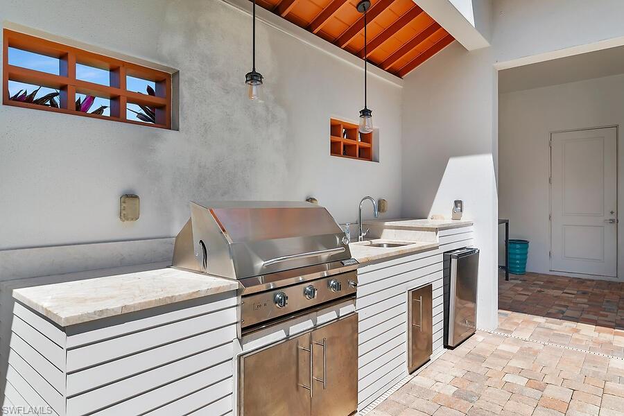 255 Columbus Way Marco Island, FL 34145 - Photo 41 of 50 a stove top oven sitting inside of a kitchen