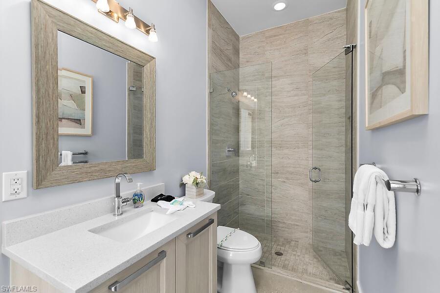 255 Columbus Way Marco Island, FL 34145 - Photo 44 of 50 a bathroom with a sink toilet and shower