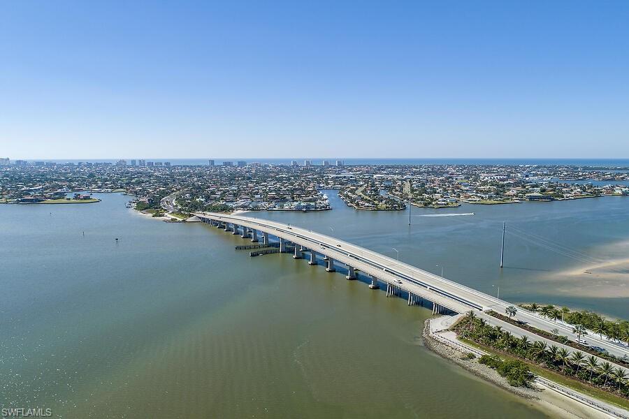 255 Columbus Way Marco Island, FL 34145 - Photo 50 of 50 an aerial view of a residential building and an ocean view