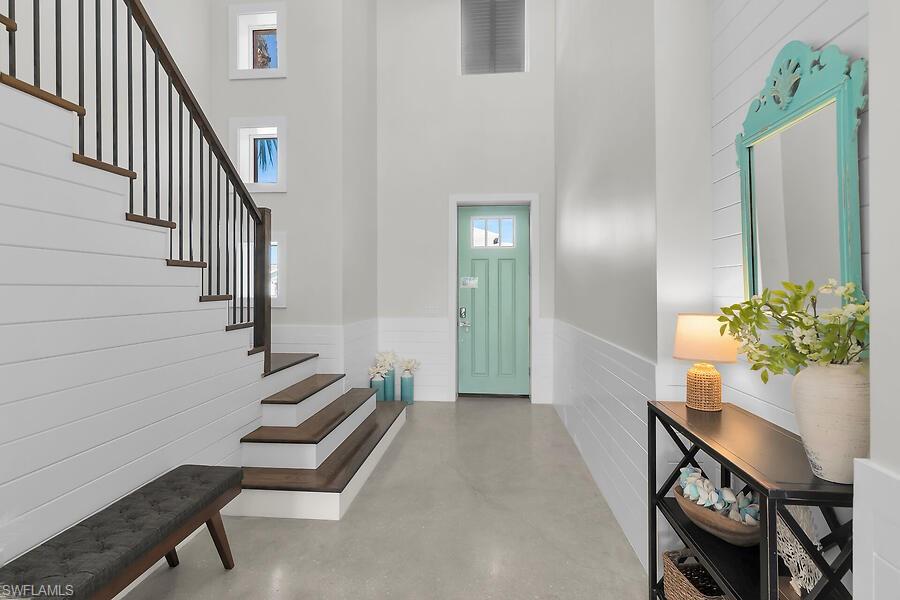 255 Columbus Way Marco Island, FL 34145 - Photo 6 of 50 a view of an entryway with wooden floor and a livingroom