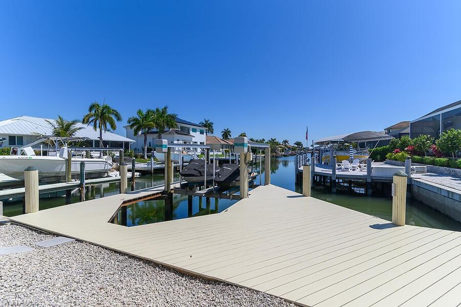255 Columbus Way Marco Island, FL 34145 - Photo 8 of 50 a view of a swimming pool with outdoor seating