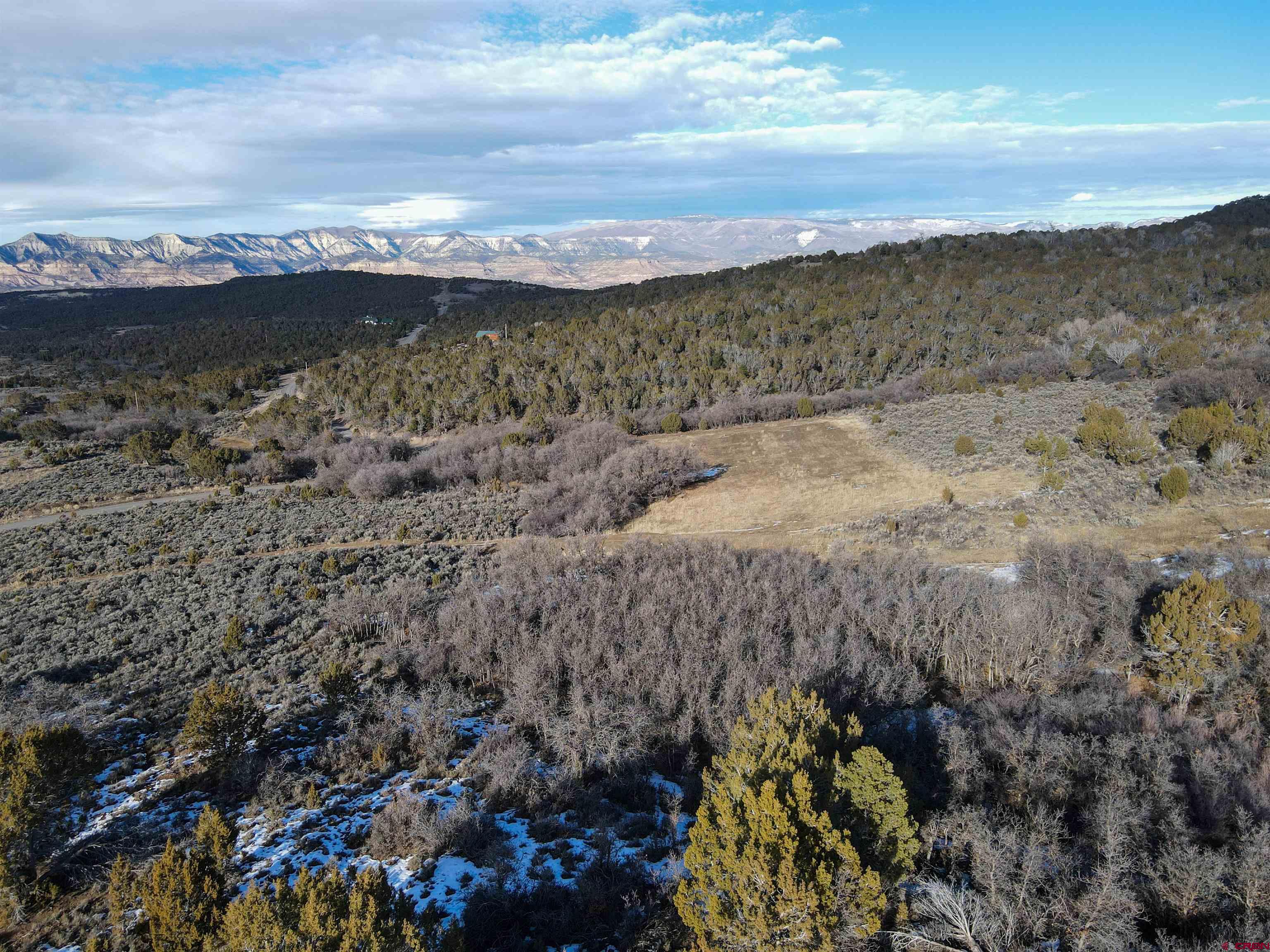Tbd 56 1/4 Road Molina, CO 81646 - Photo 22 of 44 a view of a lake with mountains in the background