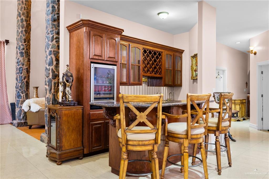 508 El Paisano Road Rio Grande City, TX 78582 - Photo 15 of 42 a front view of a livingroom with furniture and gym equipment