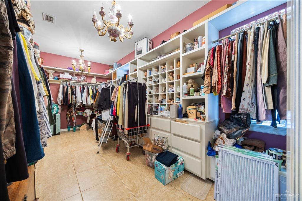 508 El Paisano Road Rio Grande City, TX 78582 - Photo 20 of 42 a view of walk in closet with clothes and shoes