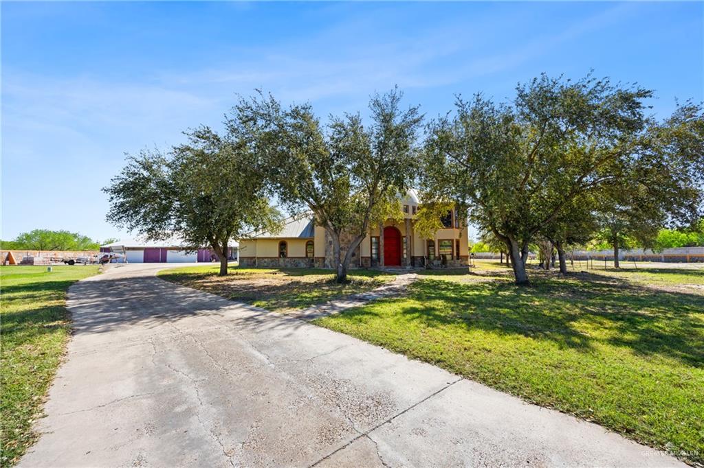508 El Paisano Road Rio Grande City, TX 78582 - Photo 2 of 42 a view of a fountain in front of a house