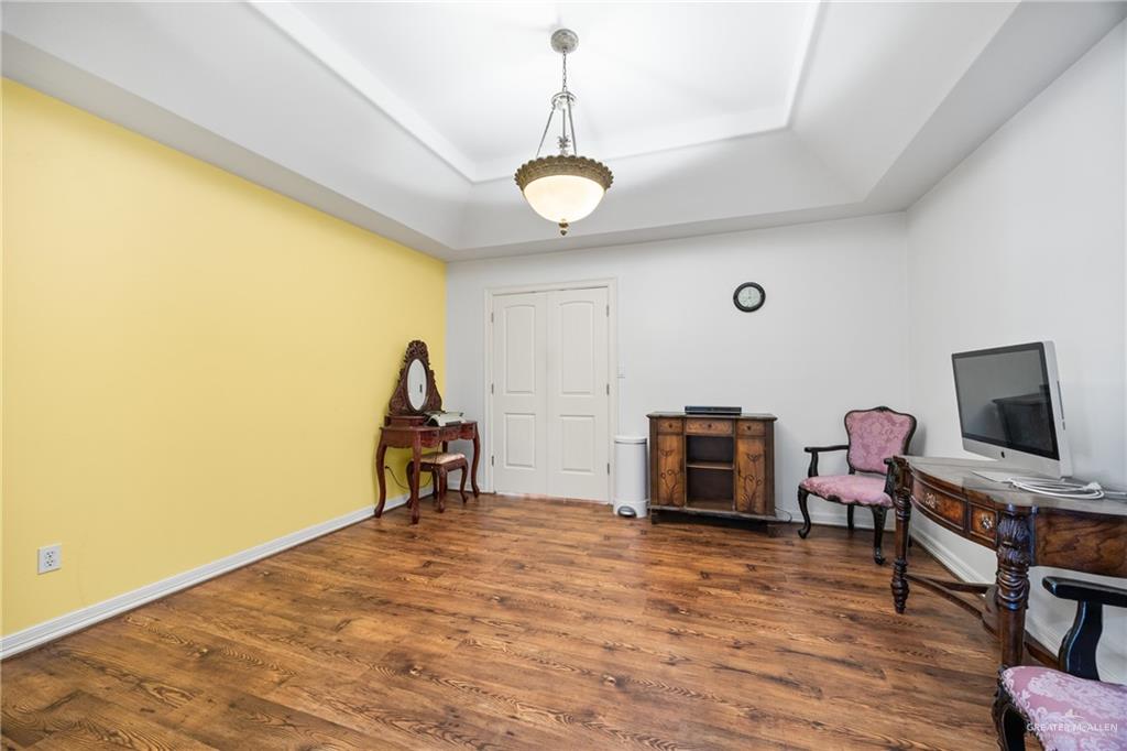 508 El Paisano Road Rio Grande City, TX 78582 - Photo 22 of 42 a view of a room with furniture and wooden floor