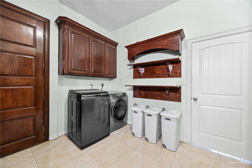 508 El Paisano Road Rio Grande City, TX 78582 - Photo 28 of 42 a utility room with dryer and washer