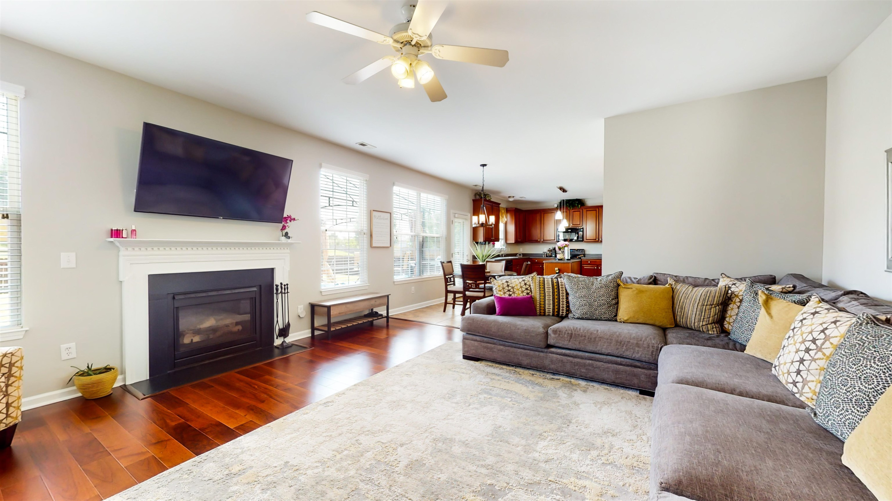 509 Ember Drive Durham, NC 27703 - Photo 11 of 24 a living room with furniture a fireplace and a flat screen tv