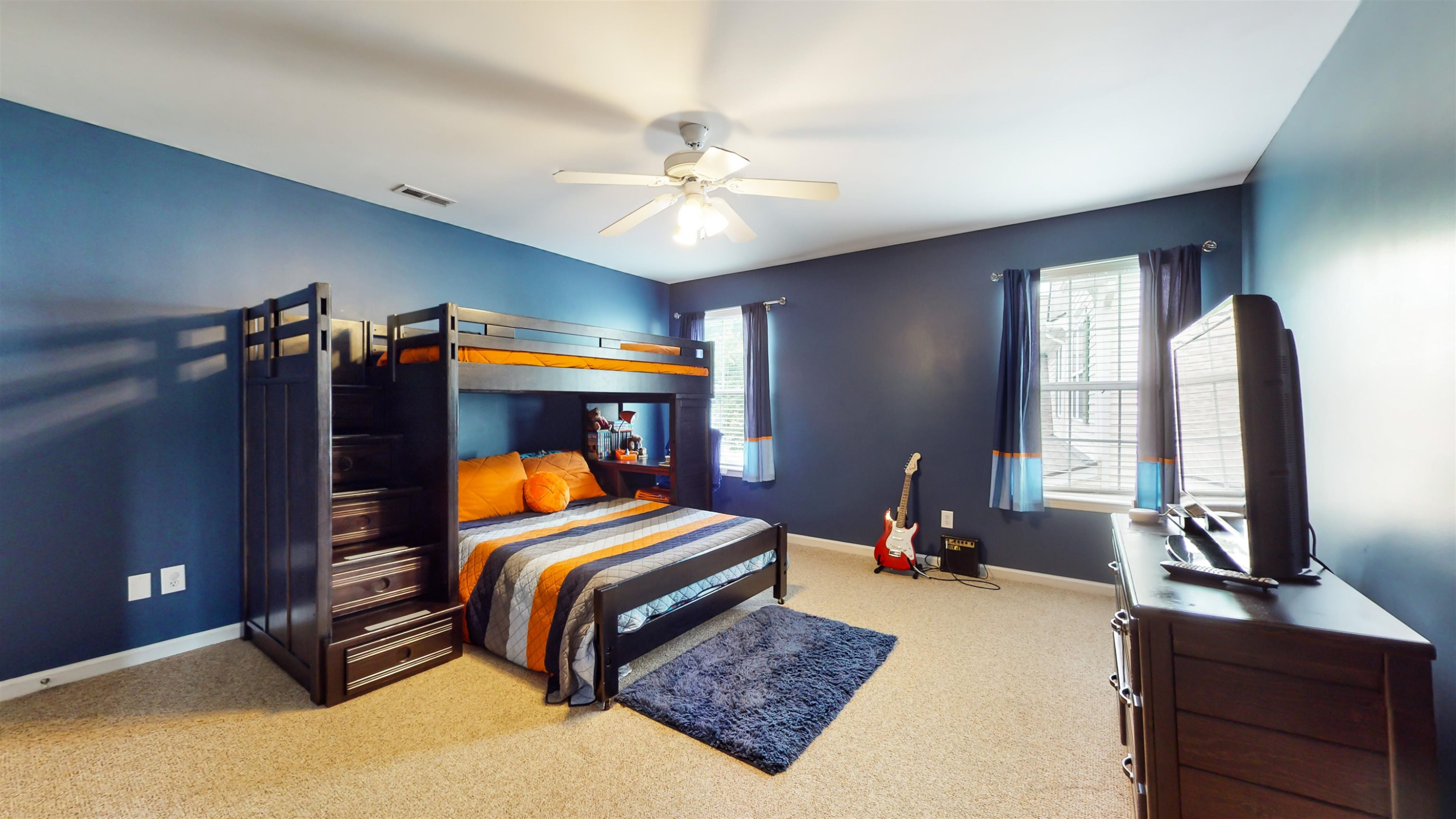 509 Ember Drive Durham, NC 27703 - Photo 12 of 24 a bedroom with a bed and wooden floor