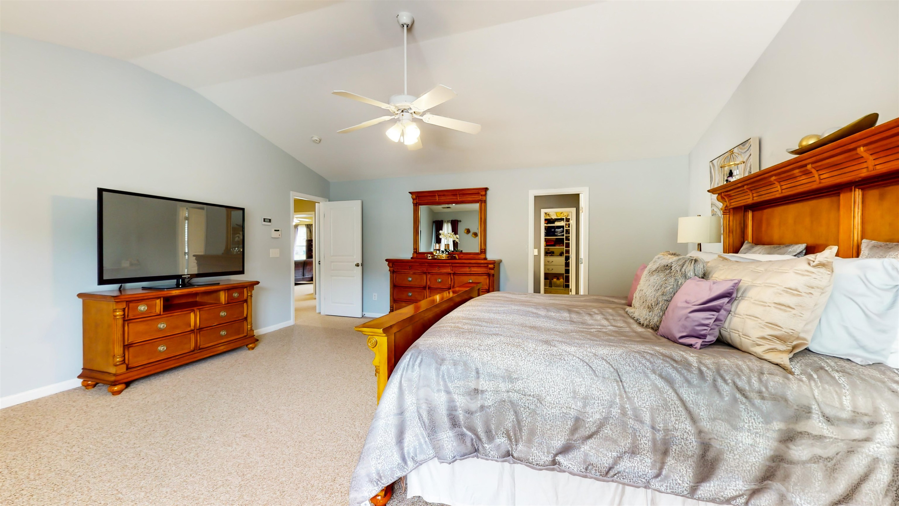 509 Ember Drive Durham, NC 27703 - Photo 14 of 24 a bedroom with a bed and a flat screen tv