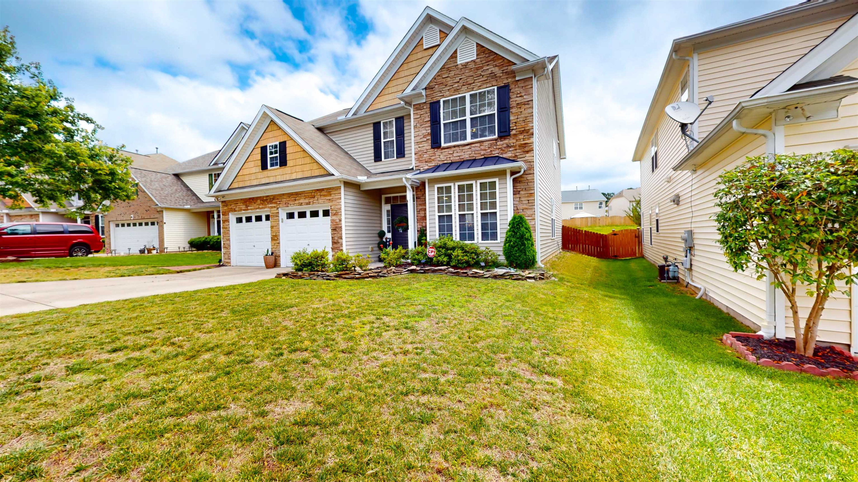 509 Ember Drive Durham, NC 27703 - Photo 2 of 24 a front view of a house with a yard