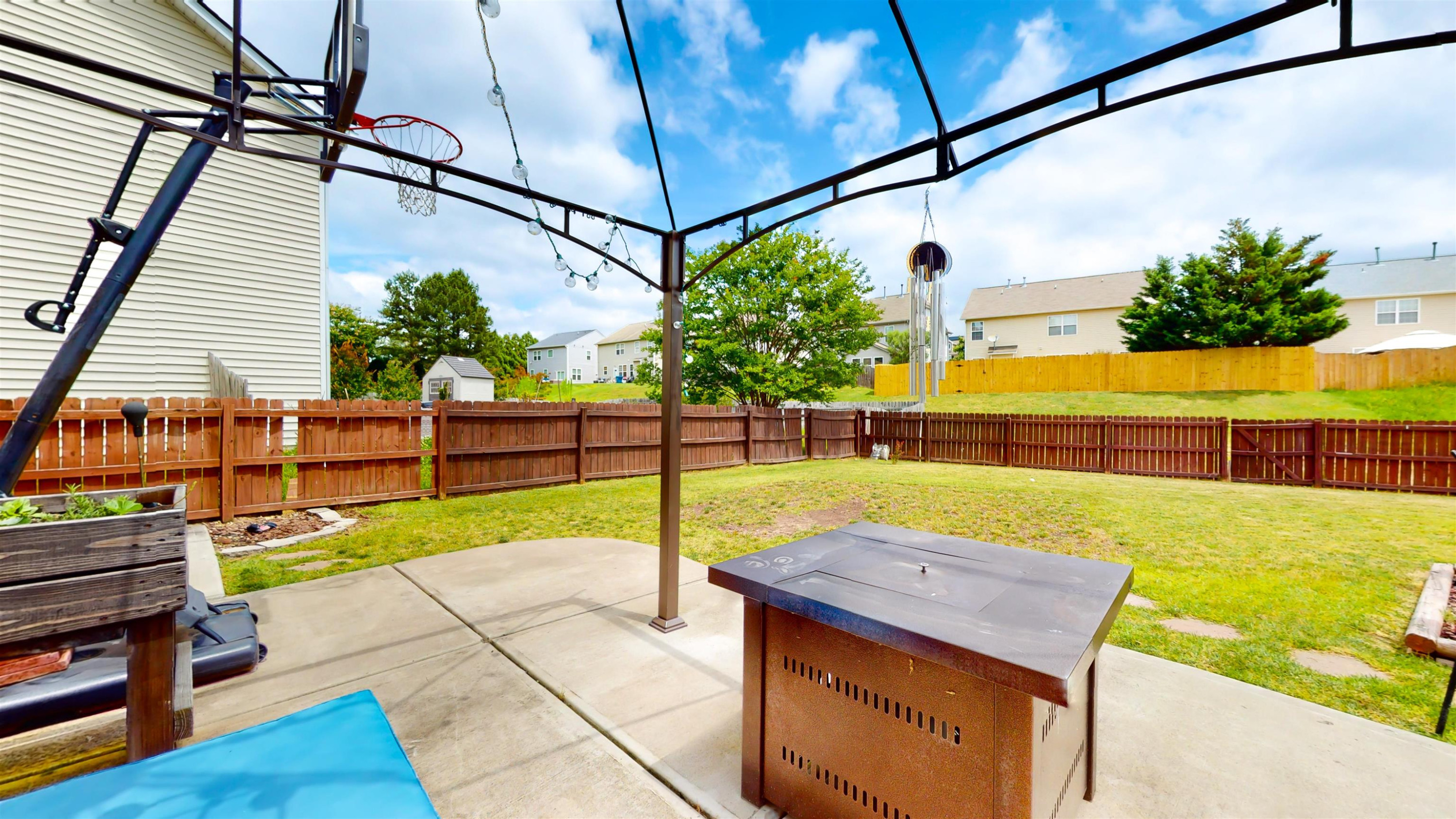 509 Ember Drive Durham, NC 27703 - Photo 23 of 24 a view of a backyard with sitting area