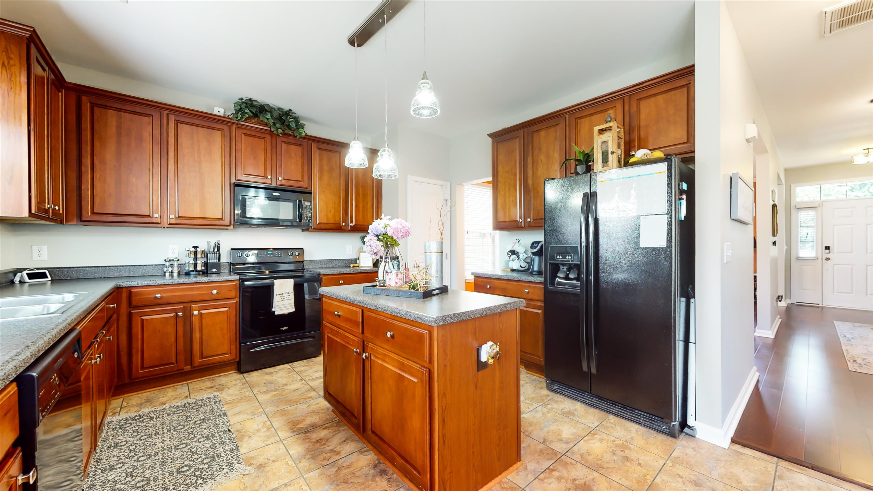 509 Ember Drive Durham, NC 27703 - Photo 7 of 24 a kitchen with stainless steel appliances granite countertop a stove a refrigerator and a sink