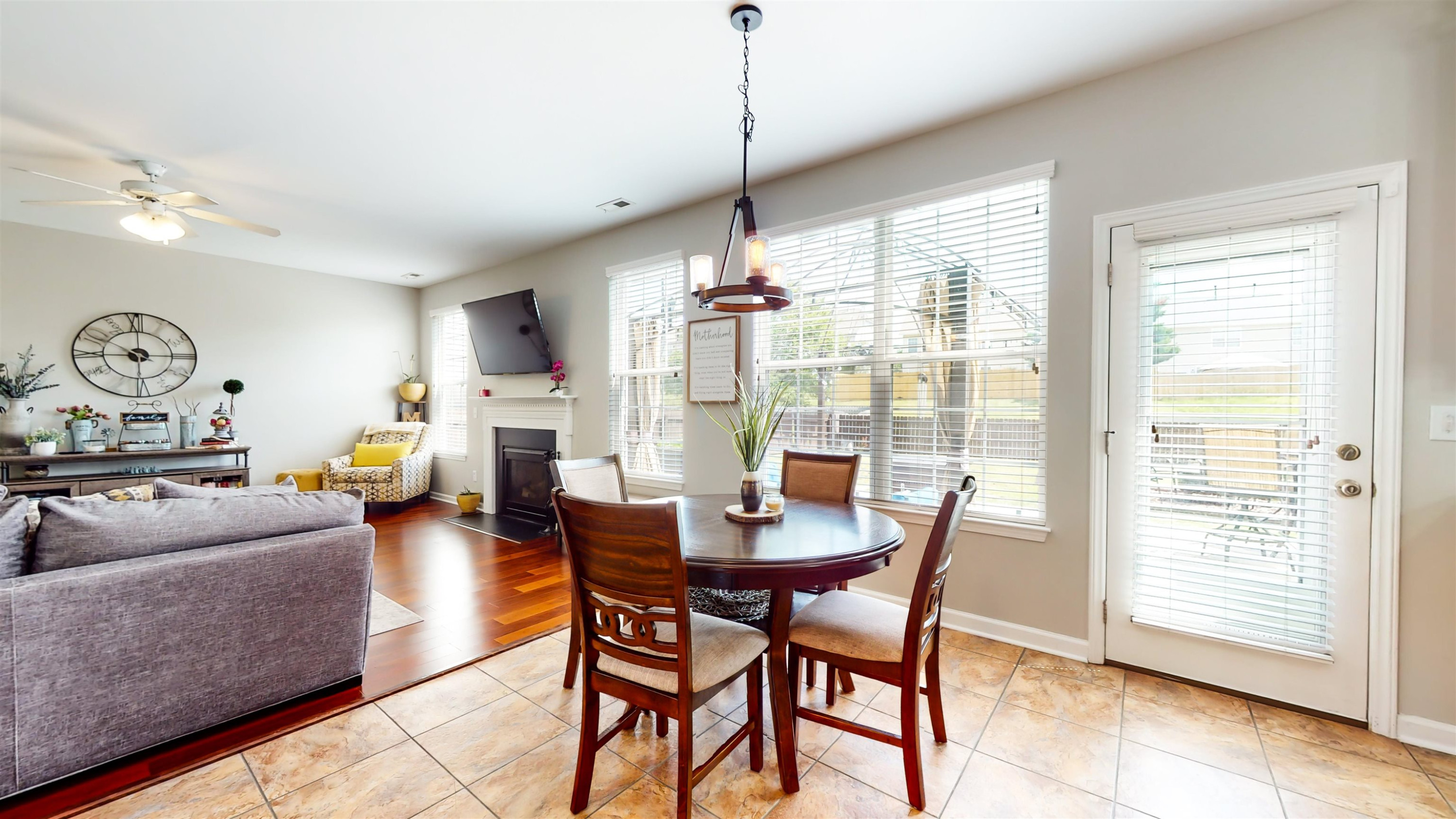 509 Ember Drive Durham, NC 27703 - Photo 9 of 24 a dining room with furniture a chandelier and wooden floor