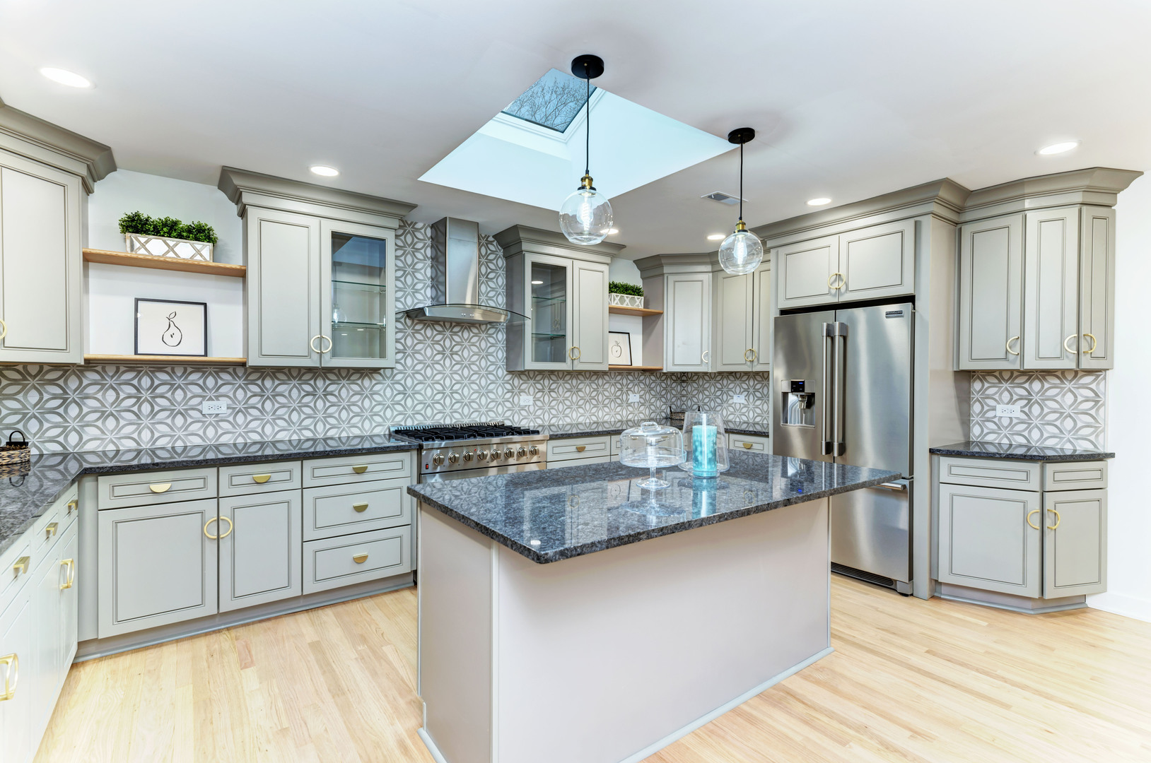 5927 Brookbank Road Downers Grove, IL 60516 - Photo 12 of 38 a kitchen with stainless steel appliances granite countertop a sink refrigerator and cabinets