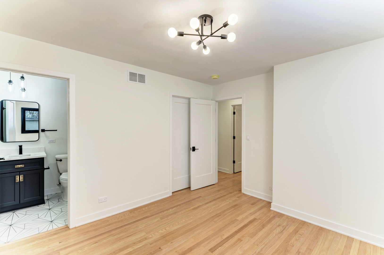 5927 Brookbank Road Downers Grove, IL 60516 - Photo 26 of 38 a view of an empty room with a bathroom and a ceiling fan