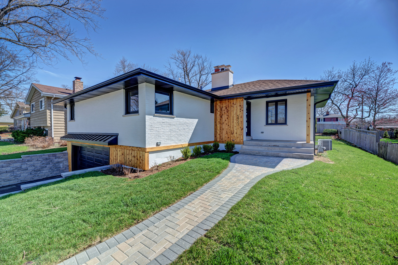 5927 Brookbank Road Downers Grove, IL 60516 - Photo 3 of 38 a front view of a house with a yard and garage