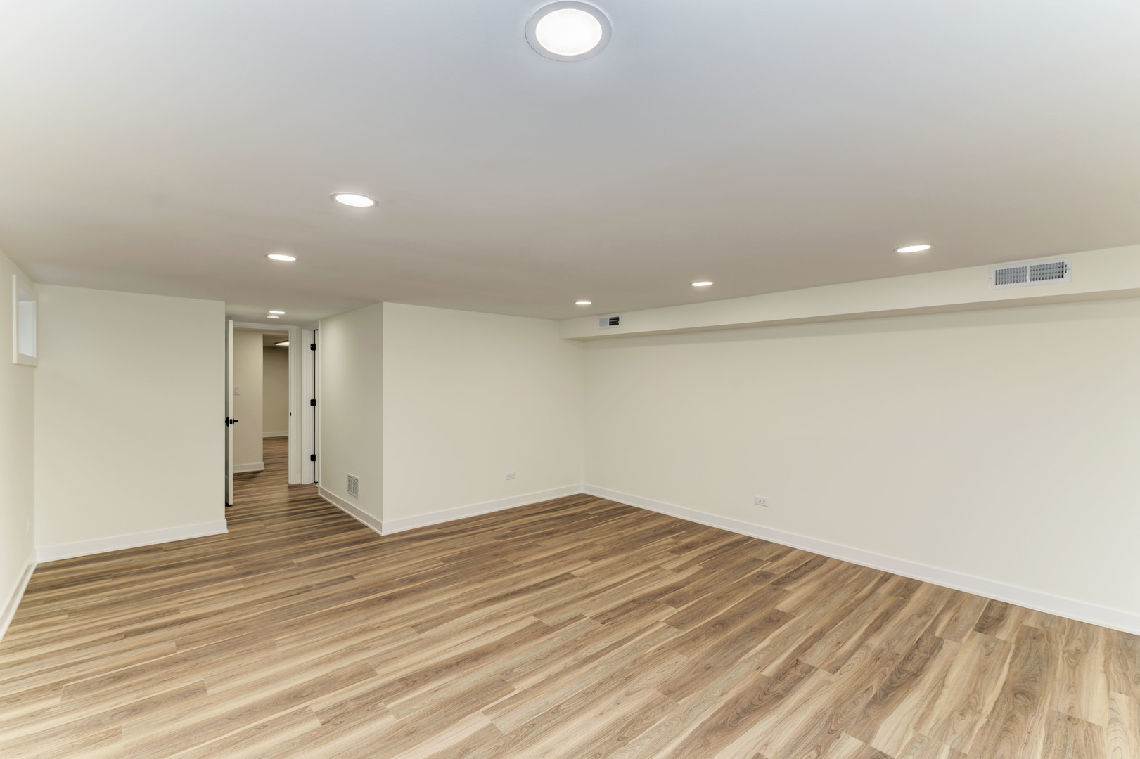 5927 Brookbank Road Downers Grove, IL 60516 - Photo 34 of 38 an empty room with wooden floor and windows