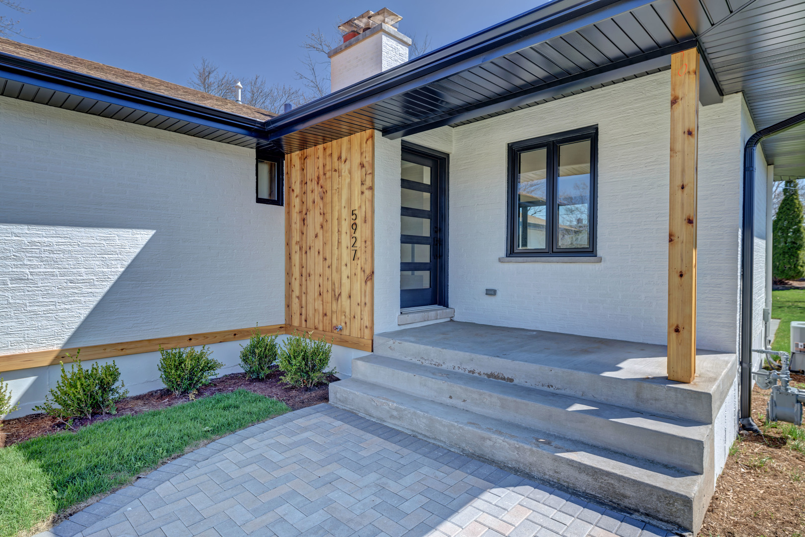 5927 Brookbank Road Downers Grove, IL 60516 - Photo 4 of 38 a front view of a house with garden