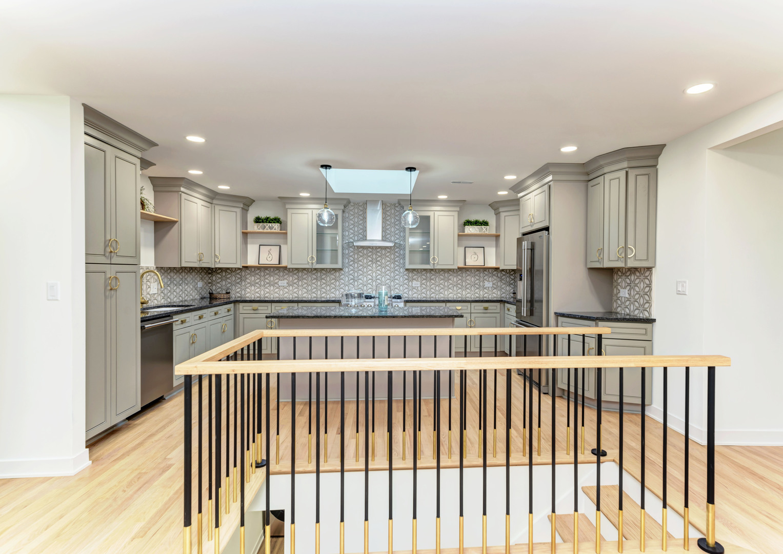 5927 Brookbank Road Downers Grove, IL 60516 - Photo 10 of 38 a kitchen with kitchen island granite countertop a sink and cabinets