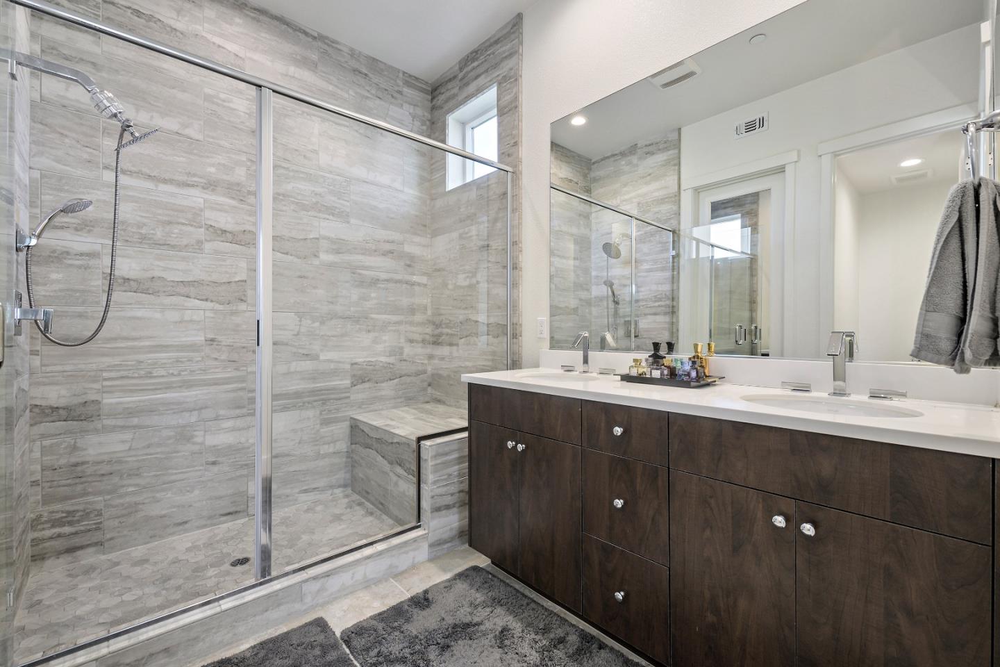 162 Nexus Loop San Jose, CA 95110 - Photo 16 of 19 a bathroom with a double vanity sink mirror and shower