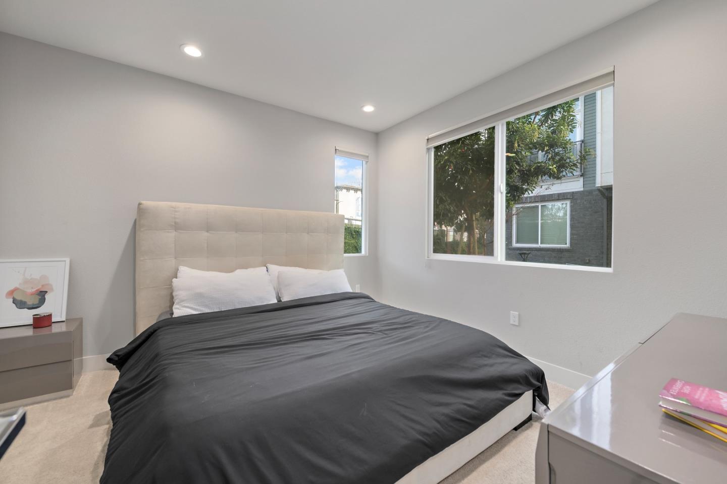 162 Nexus Loop San Jose, CA 95110 - Photo 4 of 19 a bedroom with a bed and a window