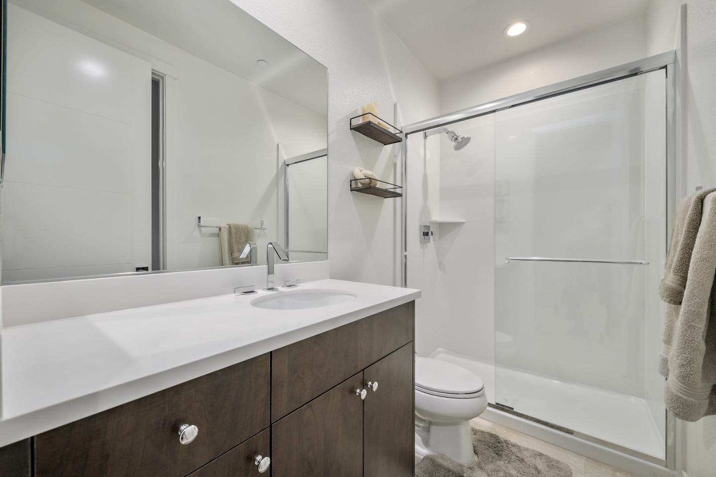 162 Nexus Loop San Jose, CA 95110 - Photo 6 of 19 a bathroom with a sink a toilet and shower