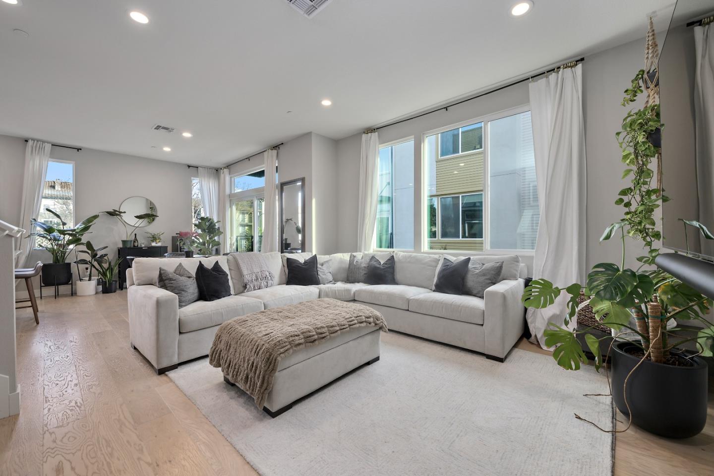 162 Nexus Loop San Jose, CA 95110 - Photo 7 of 19 a living room with furniture potted plant and a window