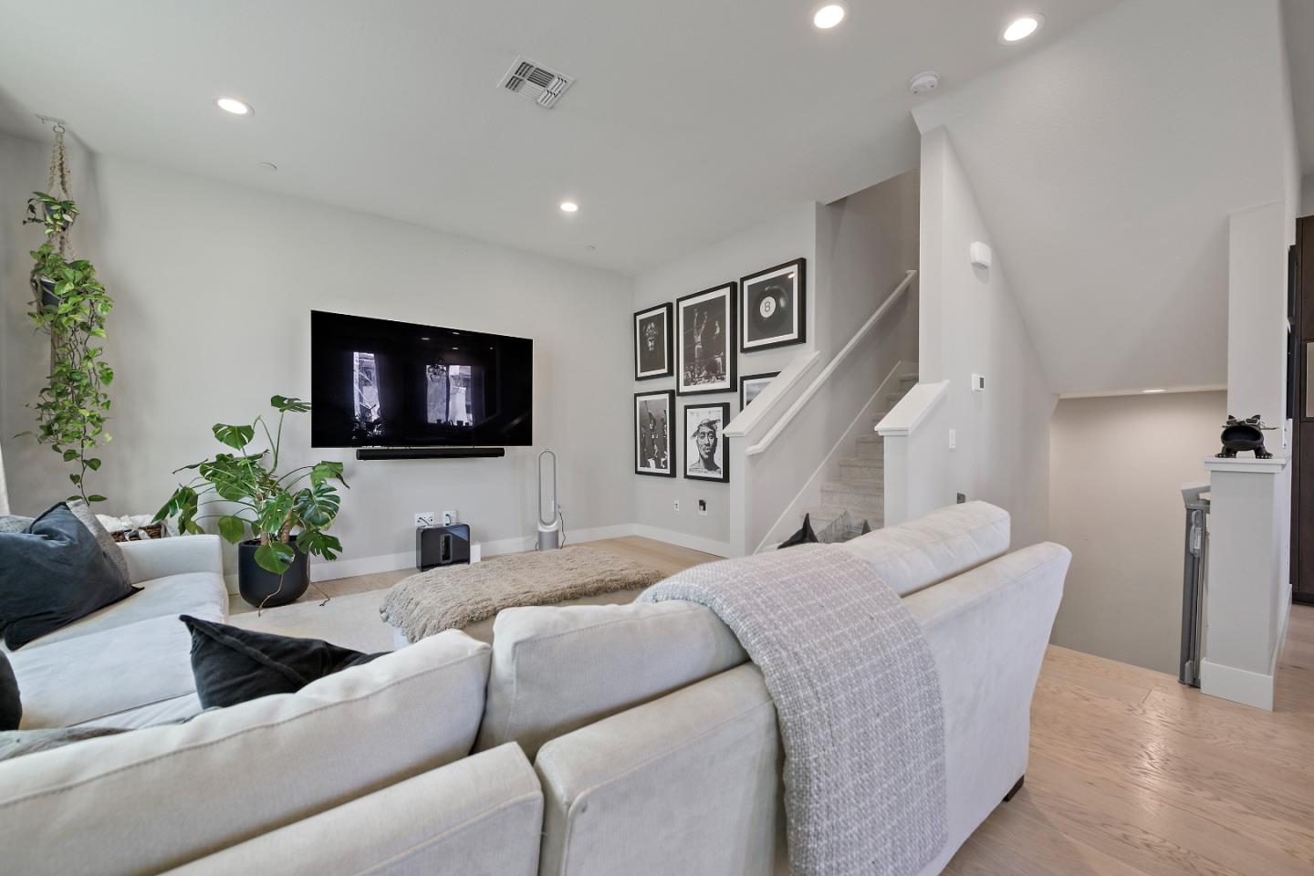 162 Nexus Loop San Jose, CA 95110 - Photo 8 of 19 a living room with furniture and a flat screen tv