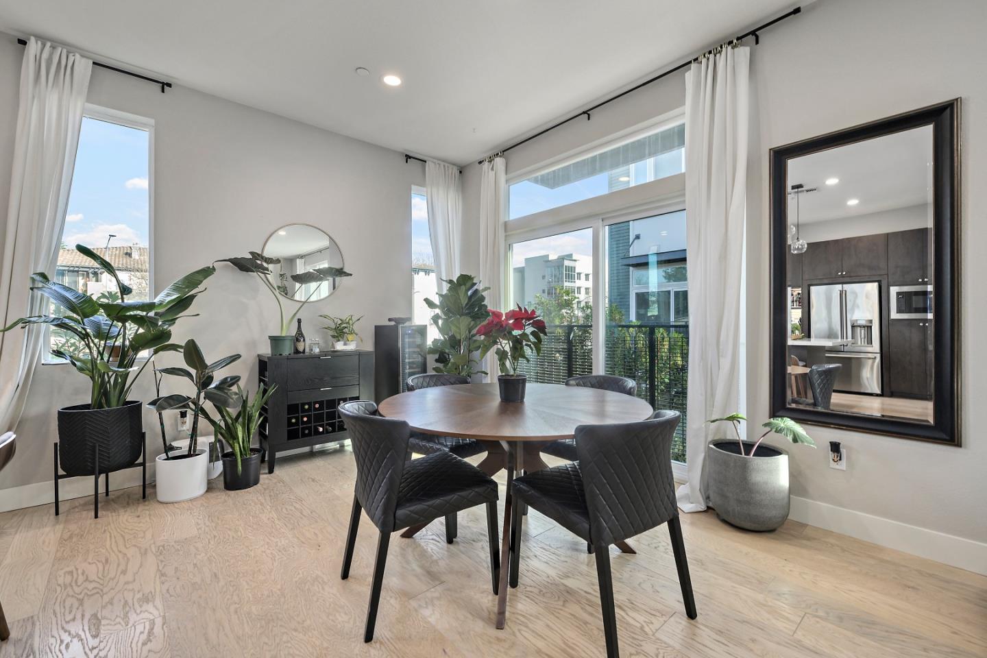 162 Nexus Loop San Jose, CA 95110 - Photo 9 of 19 a dining room with furniture and potted plants