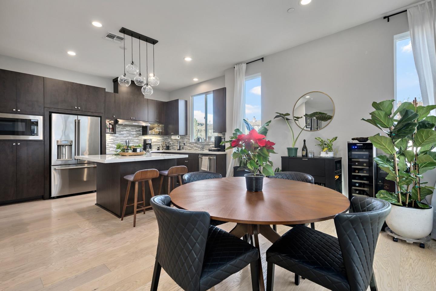162 Nexus Loop San Jose, CA 95110 - Photo 10 of 19 a kitchen with a table and chairs in it