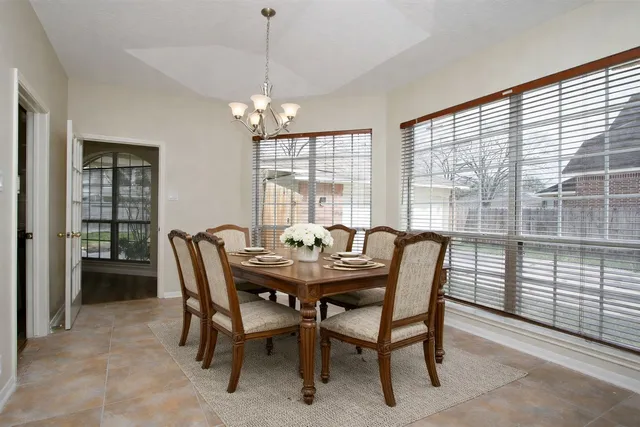 a kitchen with stainless steel appliances granite countertop wooden cabinets a stove top oven a sink and dishwasher