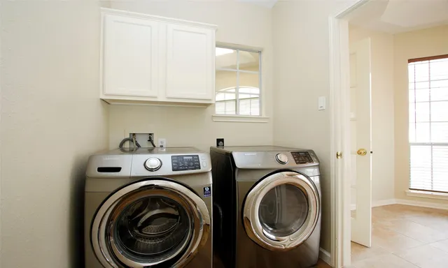 a utility room with dryer and washer