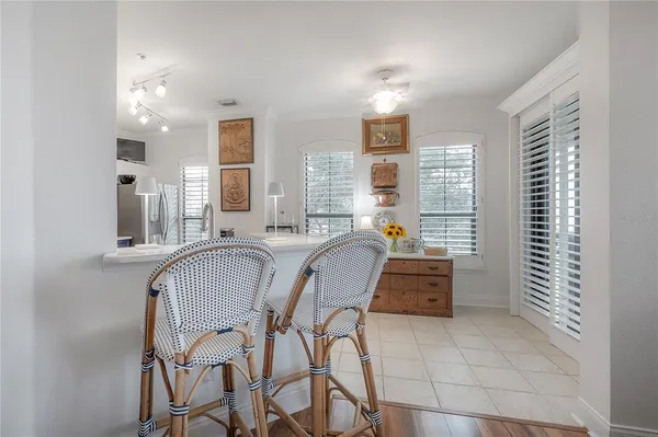 a dining room with furniture and window