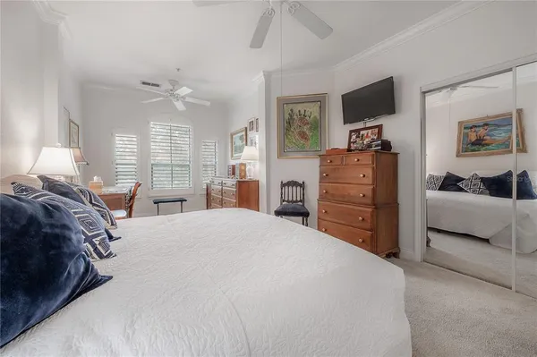 a bedroom with a bed and furniture