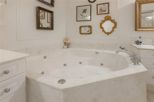 a bathroom with a tub and sink