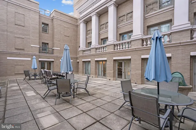 a view of a building with outdoor seating