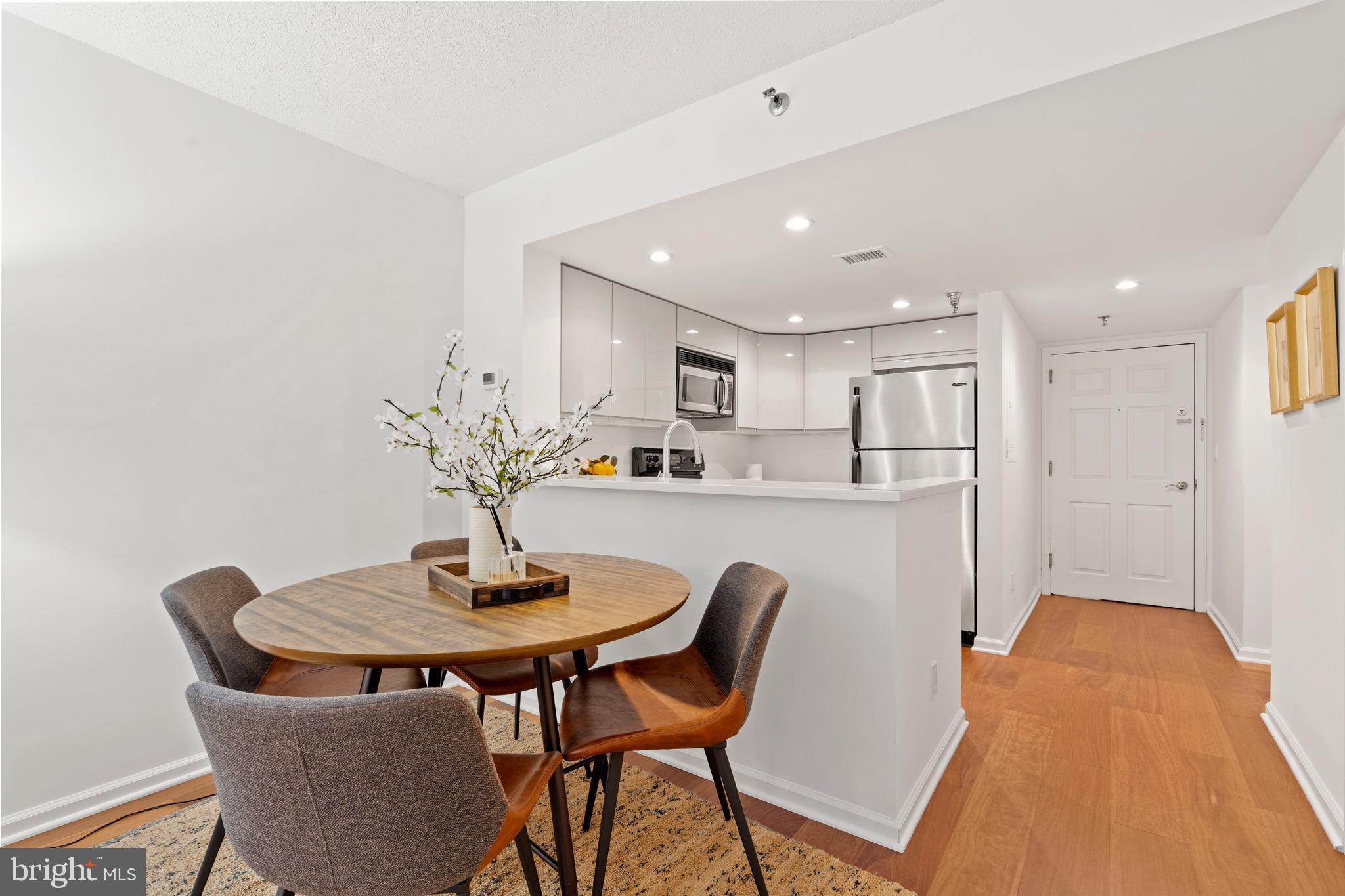801 Pennsylvania Avenue Northwest, Unit 1125 Washington, DC 20004 - Photo 5 of 25 a view of a dining room with furniture and wooden floor