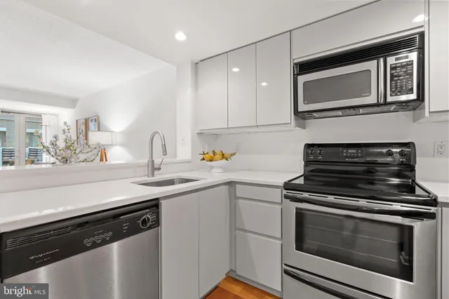 a kitchen with a stove and a microwave