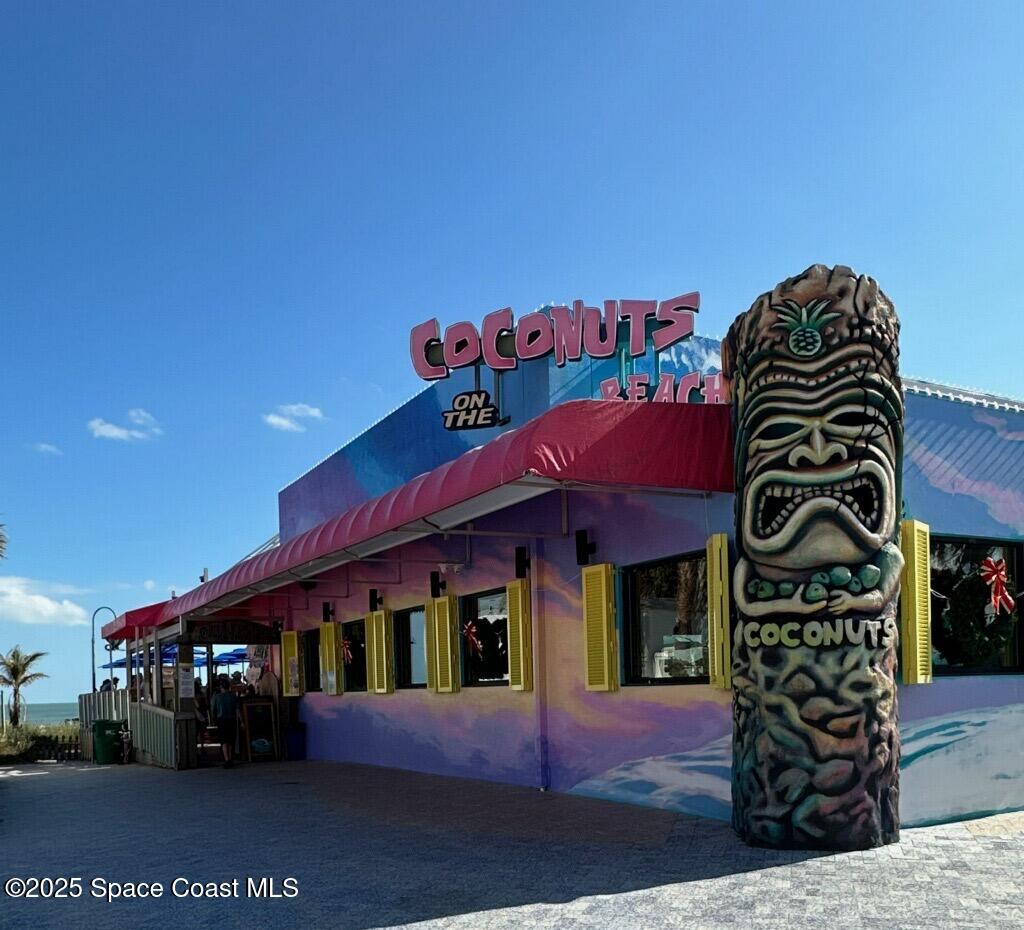 6100 Ridgewood Avenue, Unit 1 Cocoa Beach, FL 32931 - Photo 16 of 16 a front view of a building