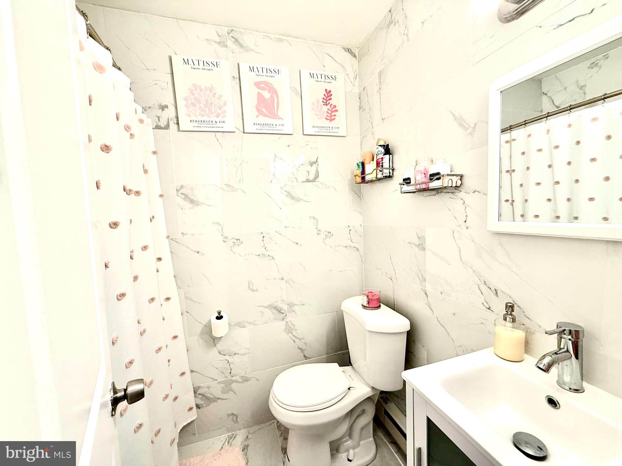 892 North 48th Street Philadelphia, PA 19139 - Photo 12 of 22 a bathroom with a sink toilet and shower