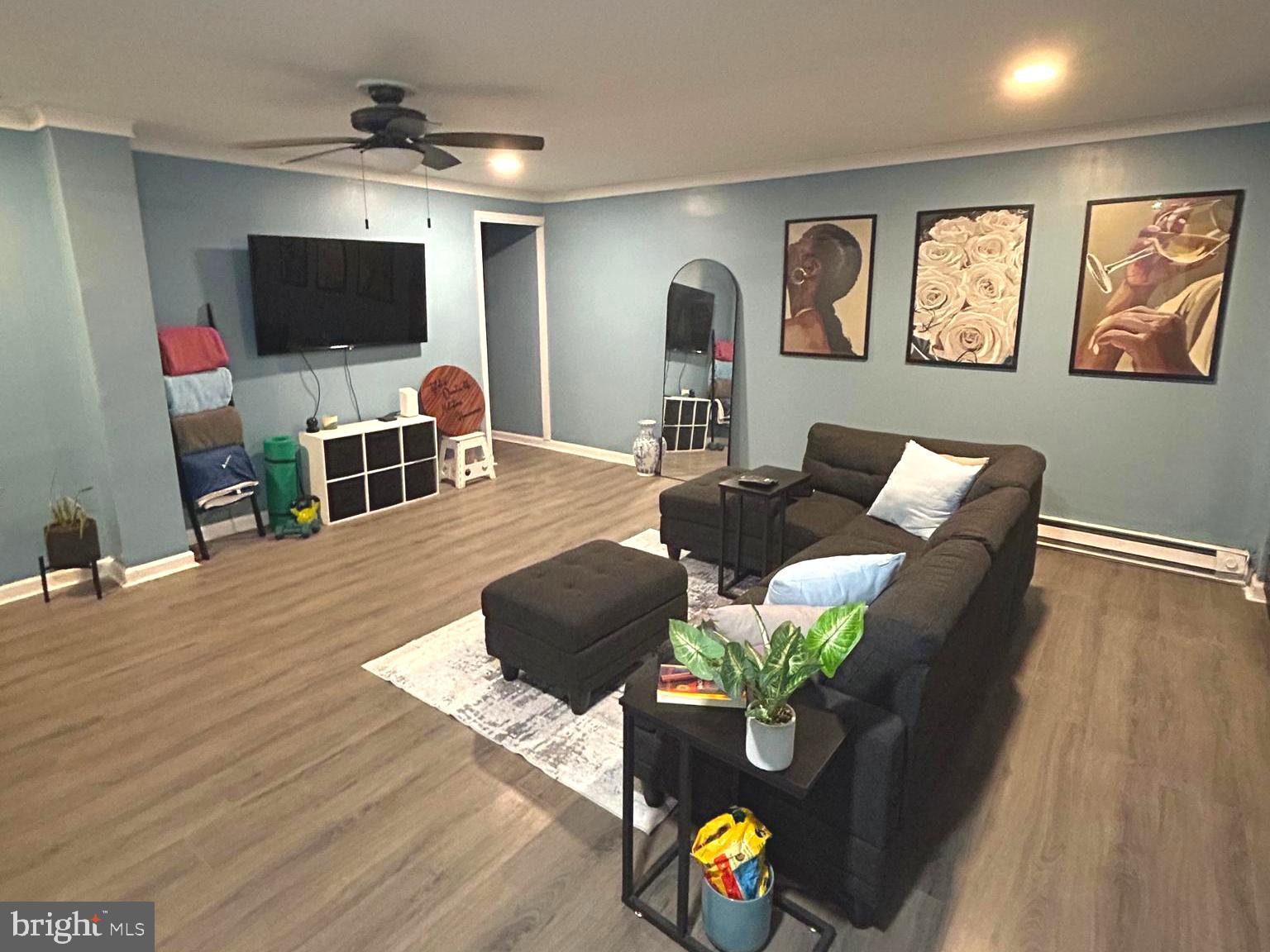 892 North 48th Street Philadelphia, PA 19139 - Photo 4 of 22 a living room with furniture and a flat screen tv