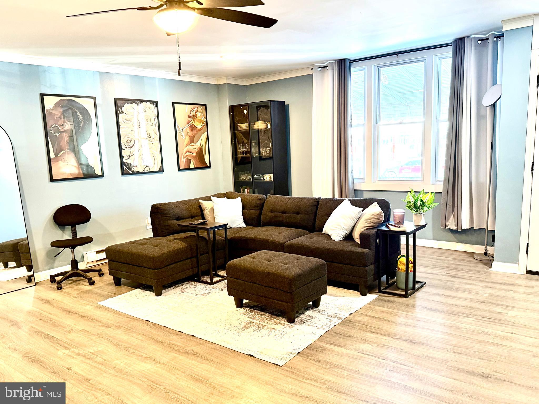 892 North 48th Street Philadelphia, PA 19139 - Photo 5 of 22 a living room with furniture and windows