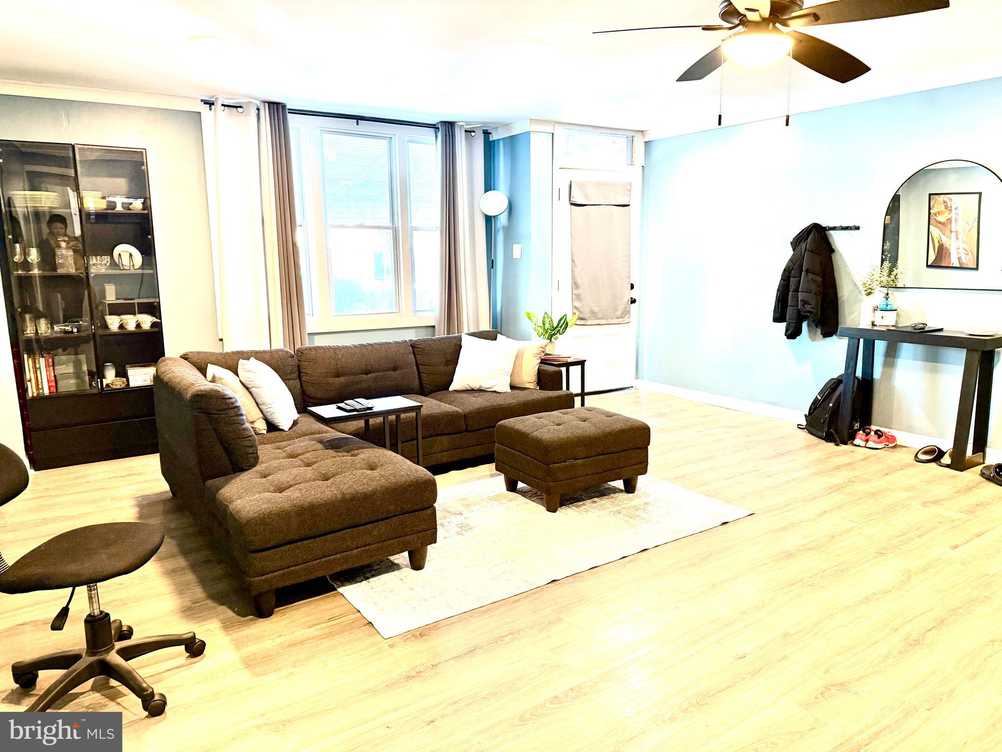 892 North 48th Street Philadelphia, PA 19139 - Photo 6 of 22 a living room with furniture and a window